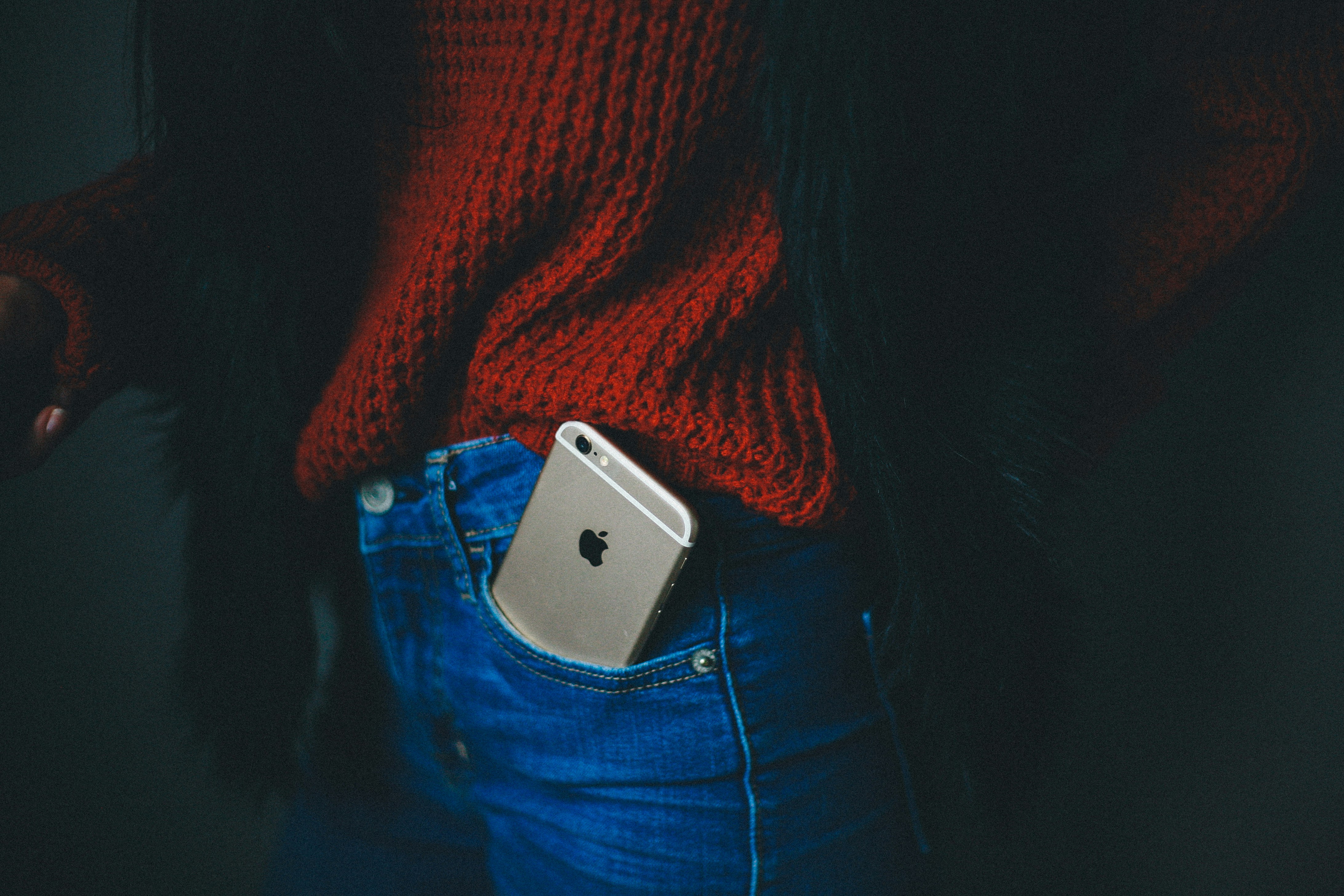 iPhone in a jeans pocket